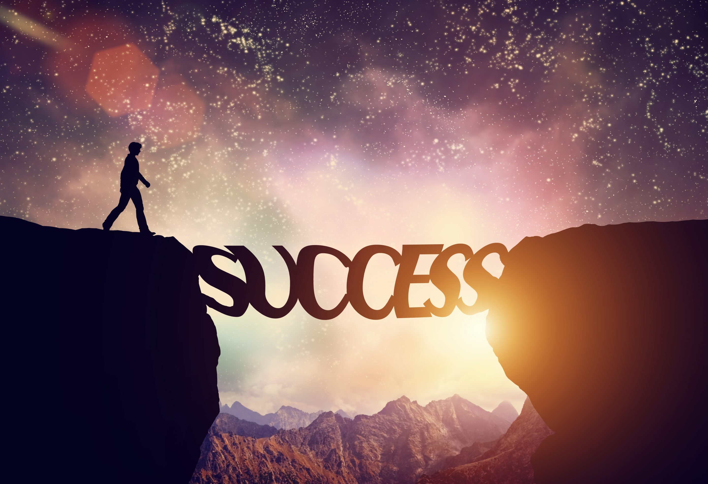Man about to walk over precipice on SUCCESS word bridge Business Coaching, A Tool of the Ultra Successful